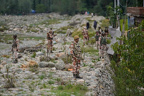 J-K Assembly polls: Indian soldiers guard during an election rally